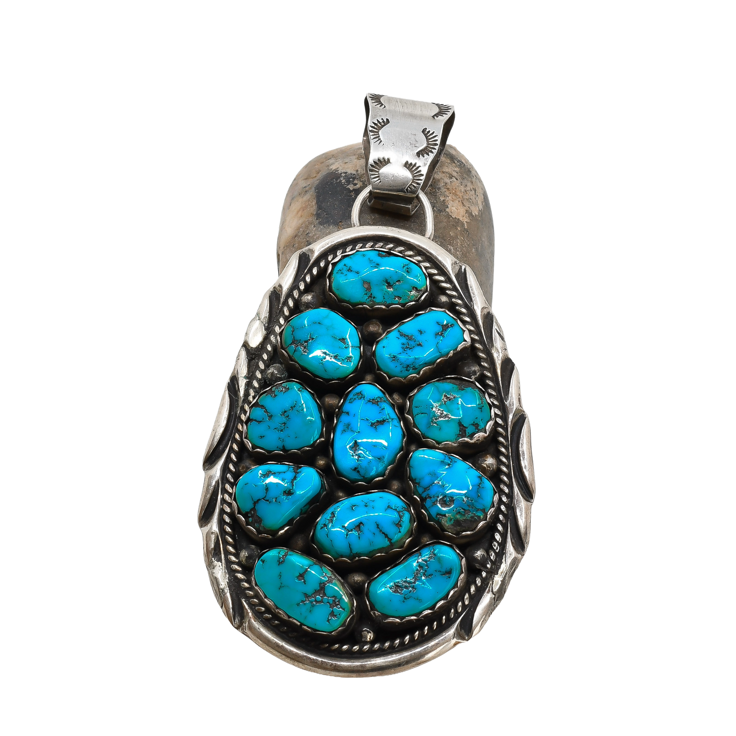 Turquoise stone pendant on a white background