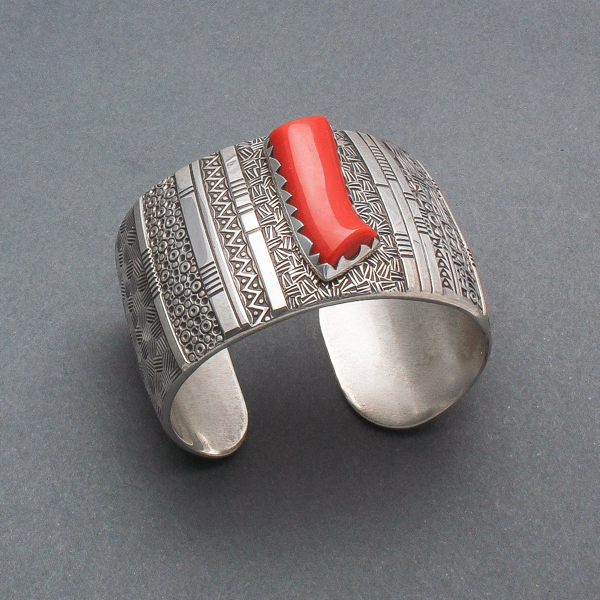 Norbert Peshlakai Wide Silver Stamped Bracelet With Coral Stone - Turquoise & Tufa
